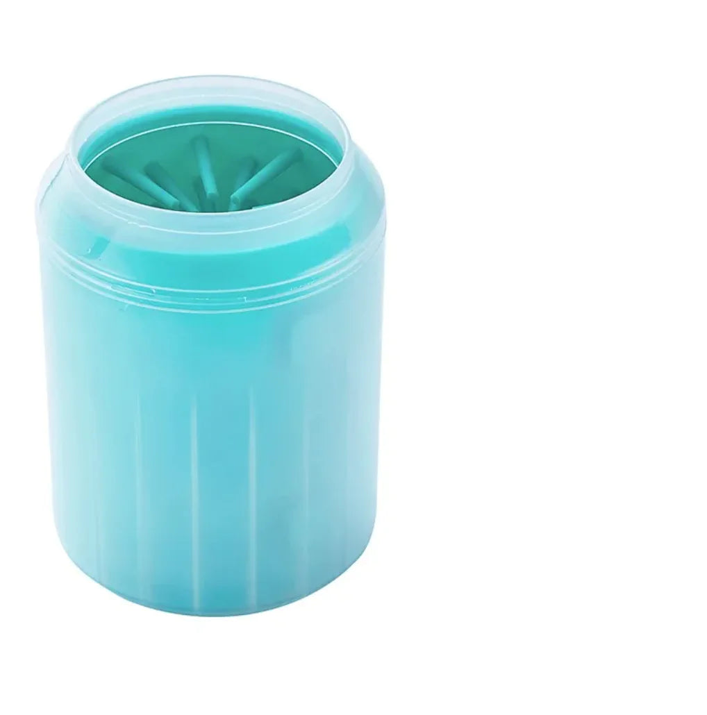 Dog paw being washed in the paw cleaner cup